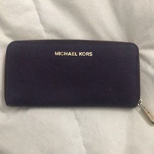 Purple Michael Kors leather wallet with zipper